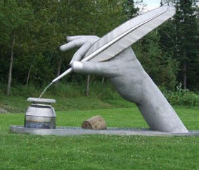 statue-hand-writing-pen